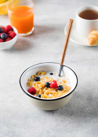 Cornflakes with berries and milk. Dry breakfast.の写真素材