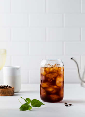 Cold black coffee with ice cubes on a white background. Coldbrew. Summer drinks.の写真素材
