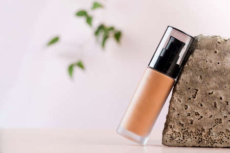 Face foundation in a glass dispenser. Layout. The concept of natural cosmetics.の写真素材