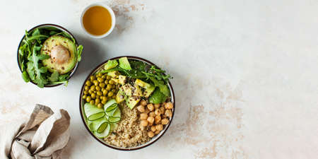 Banner healthy vegetable lunch from the Buddha bowl with quinoa, avocado, chickpeas. Copy space.の写真素材