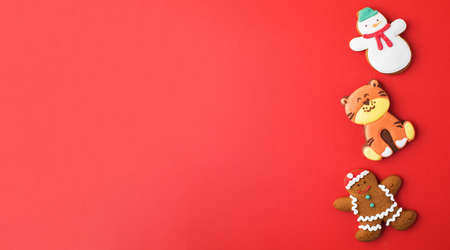 Set of traditional Christmas gingerbread on bright red background party banner. Copy space.の写真素材