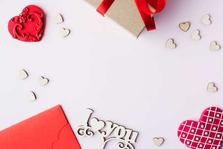 Flat lay hearts and a gift on a pink background. Valentines day concept. Copy space.の写真素材