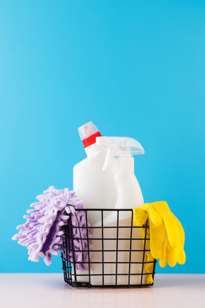 Cleaning products for cleaning, disinfection at home in a basket on a blue background.の写真素材