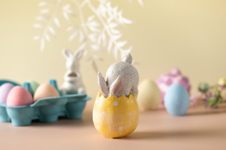 Festive Easter composition with a rabbit in an Easter egg on a floral background