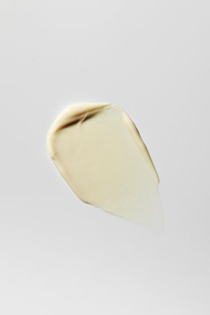 Swatch. The texture of a cosmetic product, cream on a white background. Sample of skin care cosmetics.の写真素材