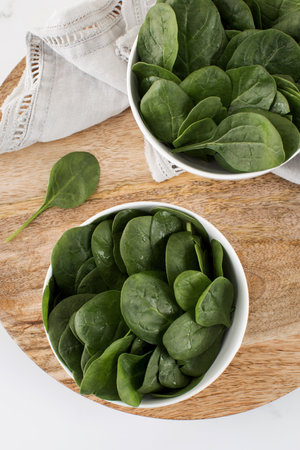 Fresh baby raw spinach on a plate. Healthy eating.の写真素材