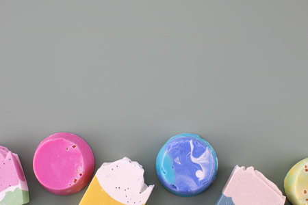 Pieces of different shapes and colors of handmade soap. Natural cosmetics. Copy spaceの写真素材