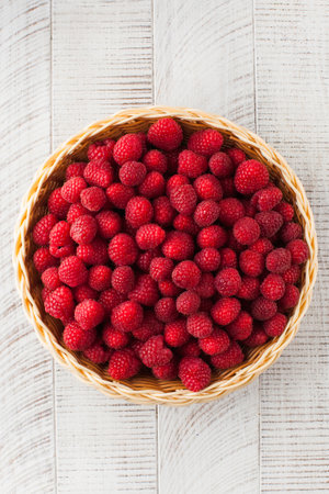 Ripe juicy raspberries close-up. Harvesting. Delicious berries.