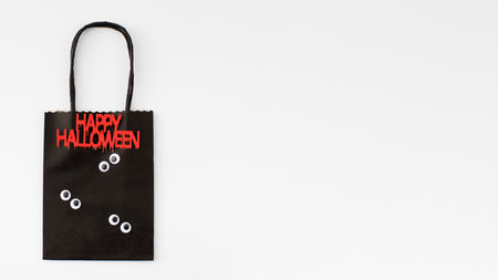 Happy Halloween sale. Paper funny Halloween-style shopping bags. Copy spaceの写真素材