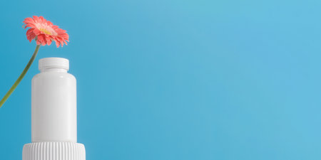 Mockup is a white jar with pills or vitamins on a podium. Vitamins for women. Copy spaceの写真素材