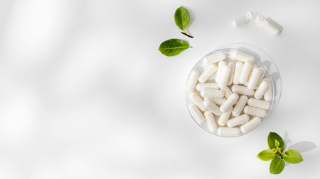 White capsules with minerals or food additives with an organic composition. Vitamins. Copy spaceの写真素材