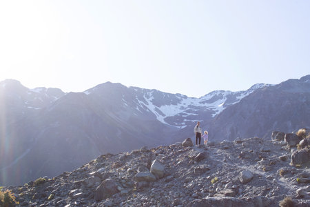 Dad and daughter travel through the mountains in New Zealand. Travel, family active recreation.の写真素材