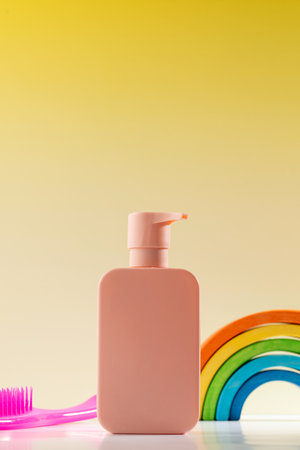 Dispenser with shower gel or shampoo for children with a comb and a toy. Skin and hair careの写真素材