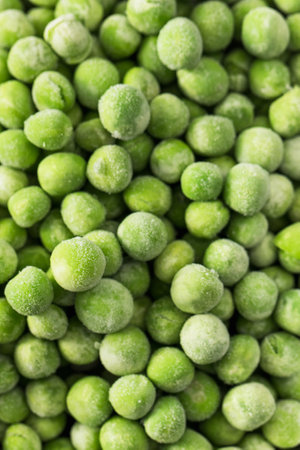 Close-up of frozen green peas. Healthy and fresh vegetables with frost on themの写真素材