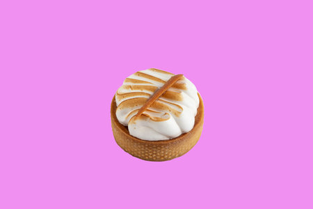 A small cake with meringue on a purple background. Dessert conceptの写真素材