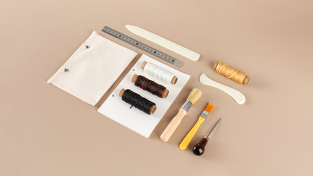 Scrapbooking kit with threads brushes and cutting tools