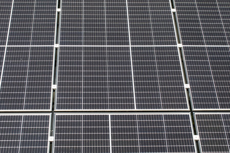 Sustainable energy solution with solar panels in nature setting.