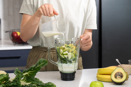 Healthy smoothie preparation with fresh fruits and vegetables for a nutritious dietの写真素材