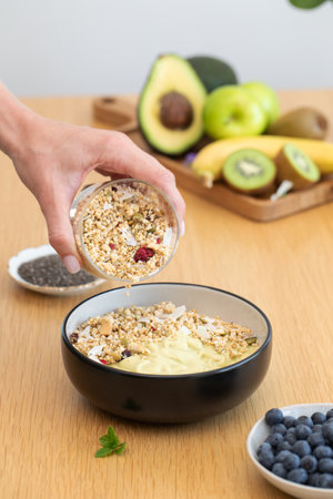 Nutritious breakfast bowl with granola and fresh fruitsの写真素材