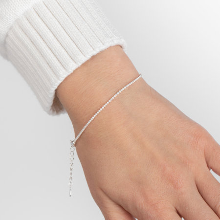 Caucasian female hand wearing elegant silver bracelet on white backgroundの写真素材