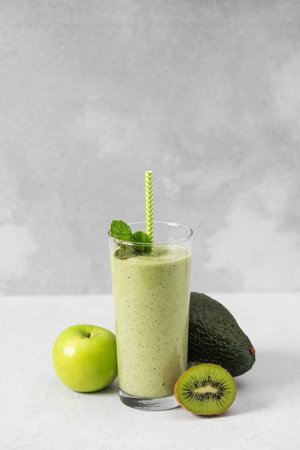 Refreshing avocado kiwi smoothie with apple and mint for a nutritious breakfastの写真素材