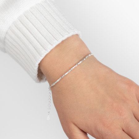 Caucasian female hand wearing elegant silver bracelet on white backgroundの写真素材