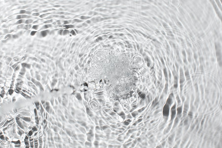 Splashing water ripple pattern with crystal clear liquid surface texture.