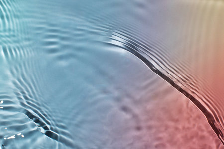 Abstract colorful background of water under sunlight. Top view, flat lay.