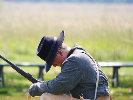 MURFREESBORO TENNESSEE / USA - September 14, 2019: A Confederate soldier pauses during a Civil War reenactment at Stones River National Battlefield.のeditorial素材