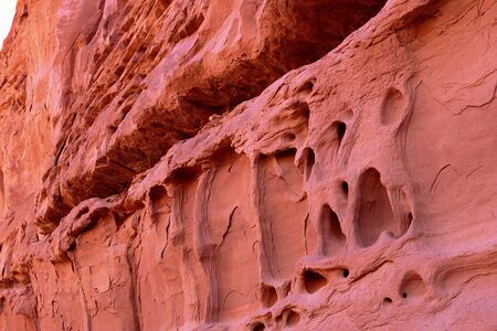 A reddish sandstone wall that appears to be meltingの写真素材