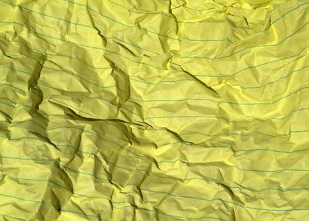 crumpled yellow paper backgroundの写真素材