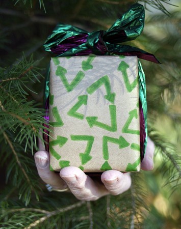 Christmas gift wrapped in recycled paperの写真素材
