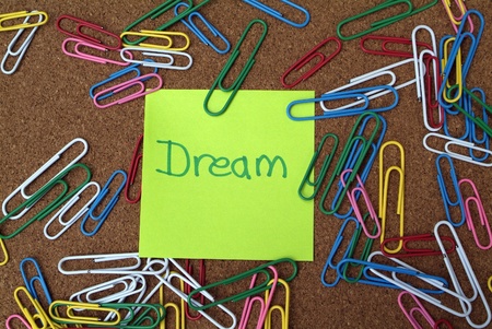 Business vision concept: Sticky note on bulletin board with the word 
