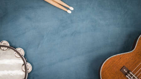 Musical instruments on blue background. Top view with copy space.の写真素材