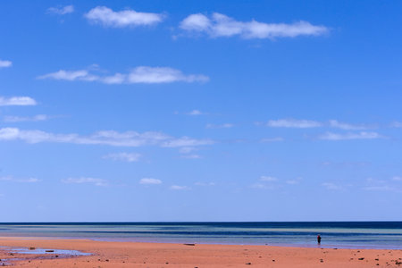 Beach at Ardrossan, South Australia, on a bright sunny day showing iron rich sand.の写真素材