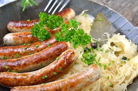 Fried sausages on sauerkrautの写真素材