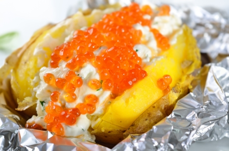 Jacket potato with spiced curd cheese and trout caviarの写真素材