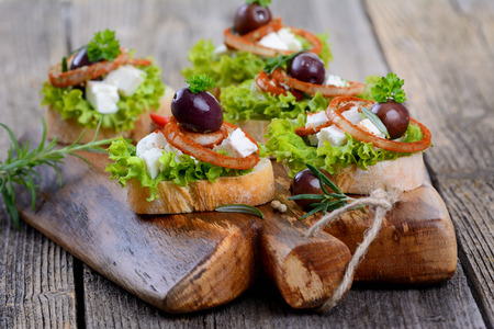 Appetizers with feta cheese and black olivesの写真素材