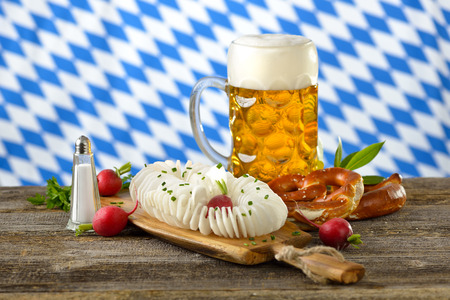 A typical Bavarian snack: Spirally cut radish with pretzels and Bavarian beerの写真素材
