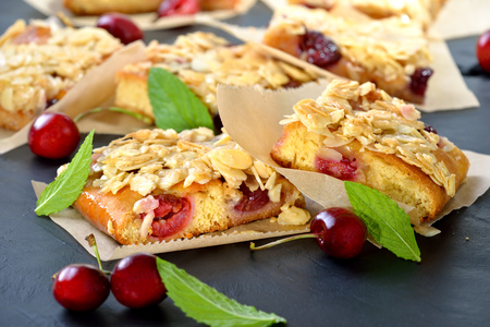Yeast cake with fresh cherries and crunchy almond caramelの写真素材