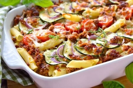 Zucchini pasta casserole with mince and cheese served hot from the ovenの写真素材