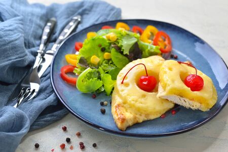 Sweet baked chicken escalope with pineapple slices and melted cheeseの写真素材