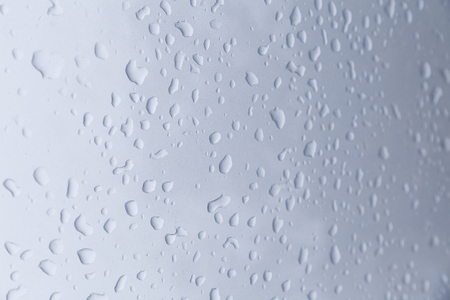 Drops of rain on a blue backgroundの写真素材