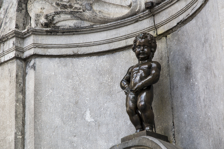 the famous statue of the picnic boy in Brussels, Belgium 06.26.2016. Editorial use only.  a statue and a fountain in the center of the capital of Europe.の写真素材