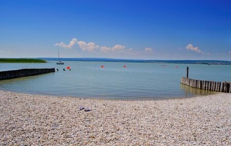Stony beach in Neusiedlsee, Austria.の写真素材