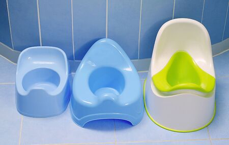 Potty training. Three kinds of pottys in the bathroom. Which potty our toddler to pee?の写真素材