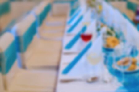 Blurry scene of table and chairs for guests at wedding. Wedding concept