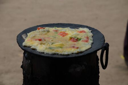Preparation of typical street food in Uganda and East Africa called Rolex.の写真素材