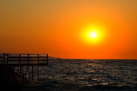 Ksamil, Ionian sea,  Albania. Sea and pier during beautiful sunset.の写真素材