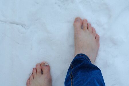 Steps of bare feet on the snowの写真素材